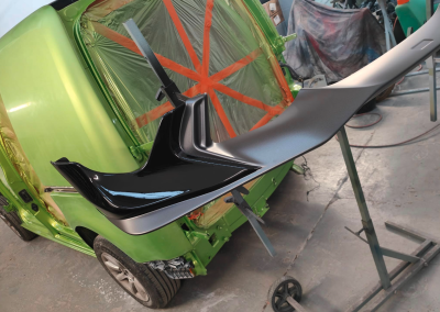 Black spoiler and green van
