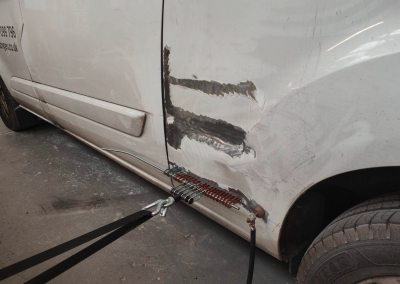 White Van dent being pulled